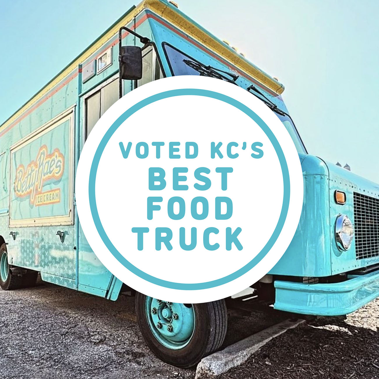 Blue food truck with a circular badge that reads Voted KC’s Best Food Truck in bold blue letters. Blue food truck with a circular badge that reads Voted KC’s Best Food Truck in bold blue letters.